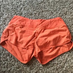 Orange Lululemon shorts